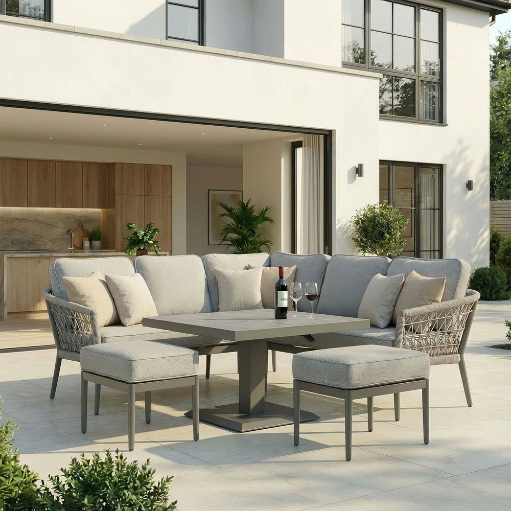 Grey outdoor corner sofa set with cushions and dining table on modern patio