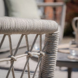 Close-up of grey rope outdoor furniture armrest with woven detailing