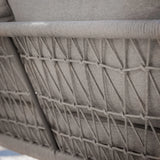 Close-up of woven rope backrest detail on grey outdoor sofa
