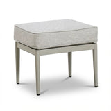 Modern ottoman with light grey cushion and metal legs on white background