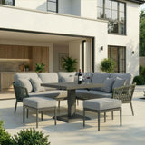 Grey outdoor sofa set with cushions and square dining table on modern patio