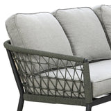 Grey outdoor sofa with rope-woven armrest and metal frame, close-up of cushions and side