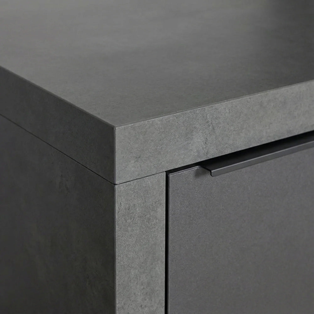 Close up of grey stone effect cabinet with matte finish and integrated handle