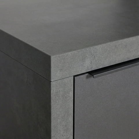 Close up of grey stone effect cabinet with matte finish and integrated handle