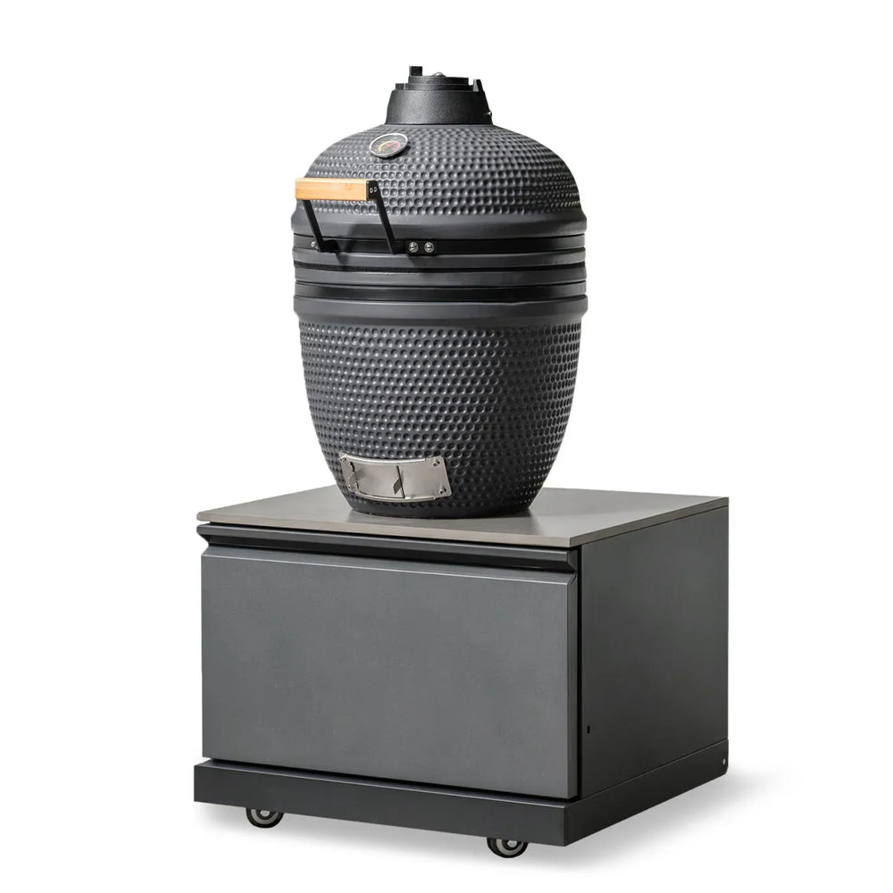 Black ceramic BBQ grill with temperature gauge on a metal rolling storage unit