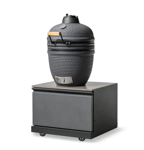 Black ceramic BBQ grill with temperature gauge on a metal rolling storage unit