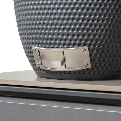 Detail of grey textured ceramic fire pit with stainless steel vent on stone base