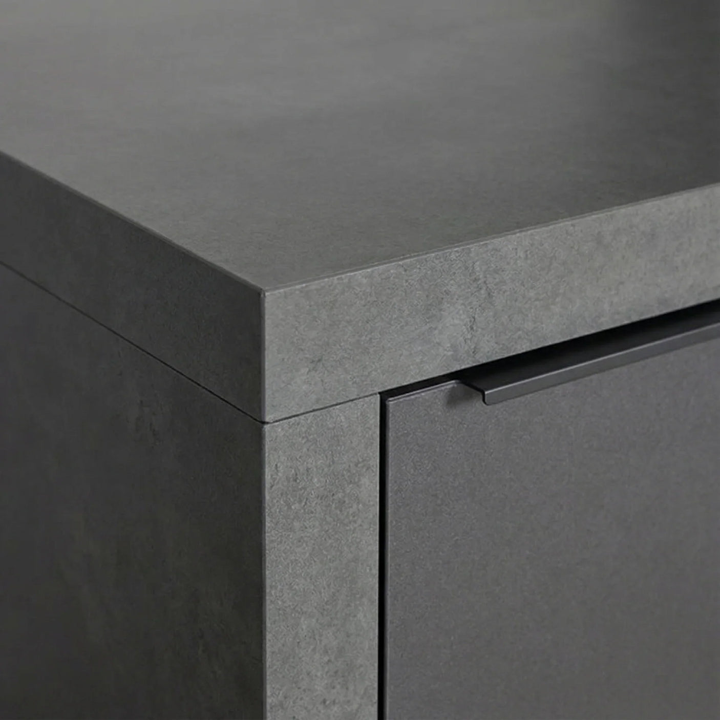 Close up of grey stone-effect cabinet with flat handle and modern finish