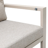 Beige fabric sofa seat cushion and metal armrest, close-up of upholstery texture