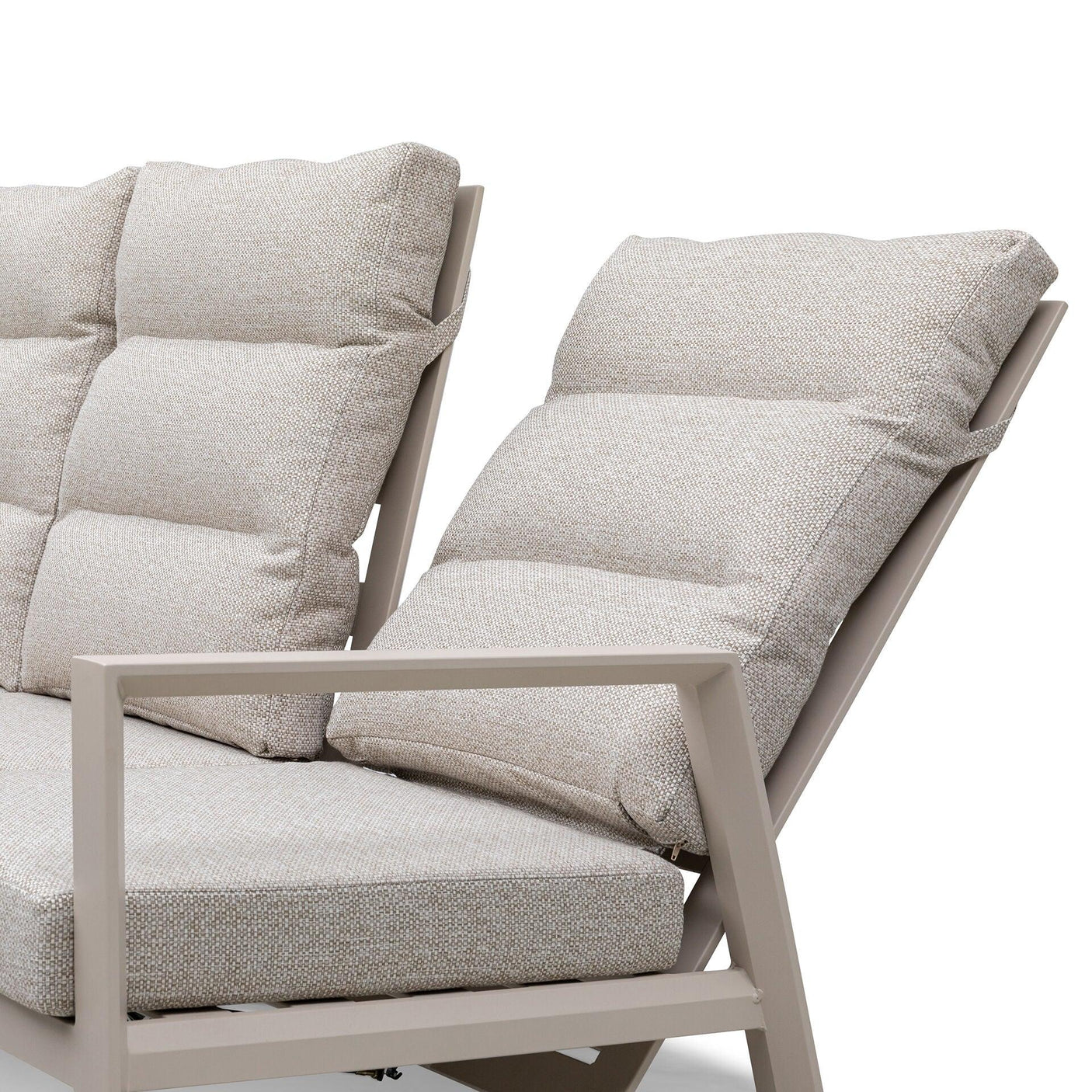 Beige fabric cushioned sofa with angled backrest and taupe metal armrest close-up