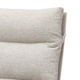 Close-up of beige fabric sofa cushion with textured detail and visible stitching
