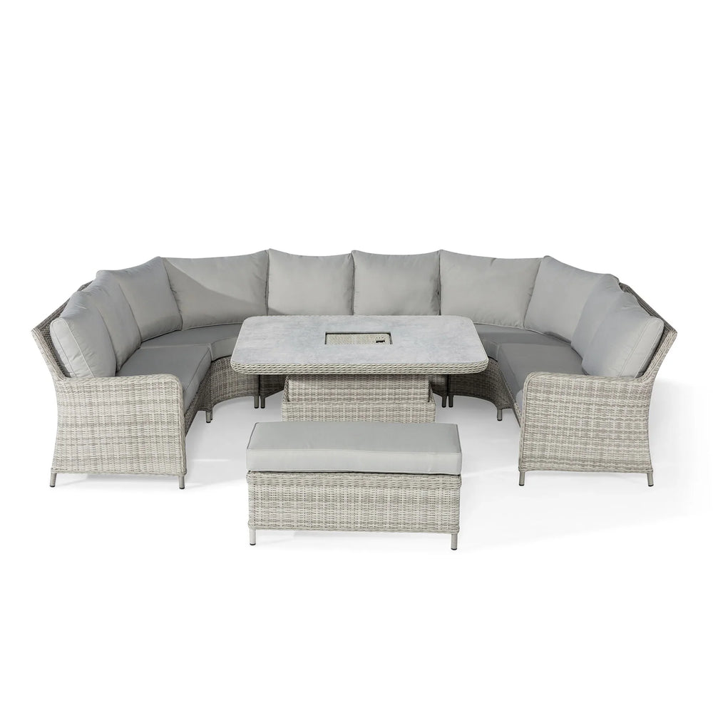 Grey rattan corner garden sofa set with cushions, matching table and bench seating