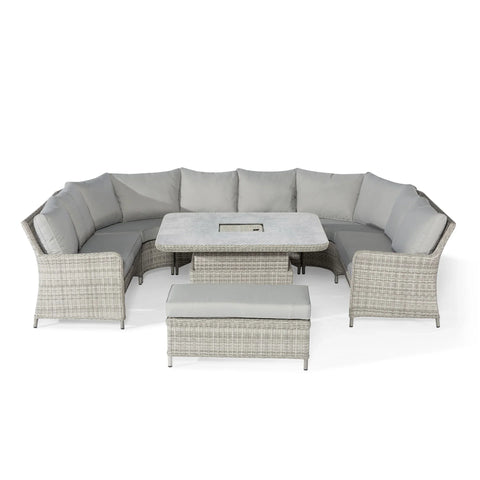 Grey rattan corner garden sofa set with cushions, matching table and bench seating