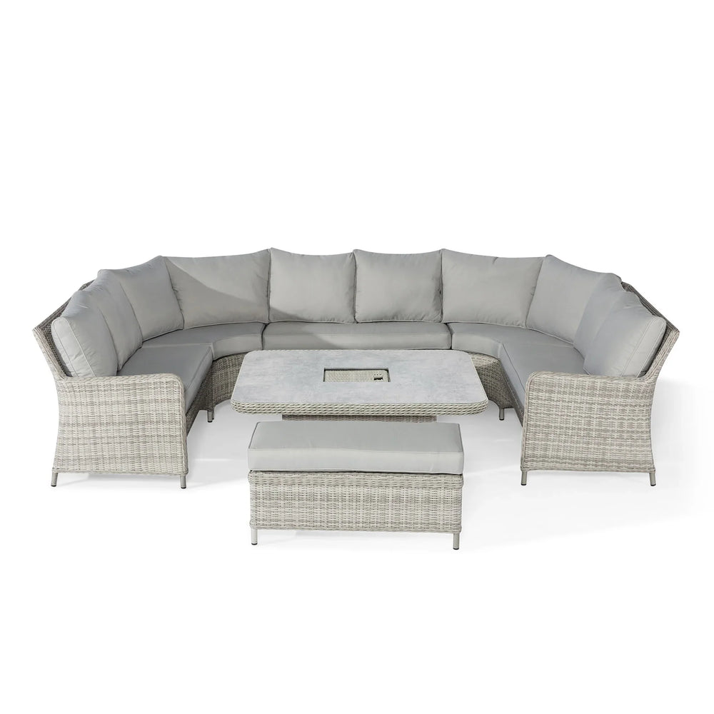Grey rattan corner garden sofa set with cushions, square table and bench on white background