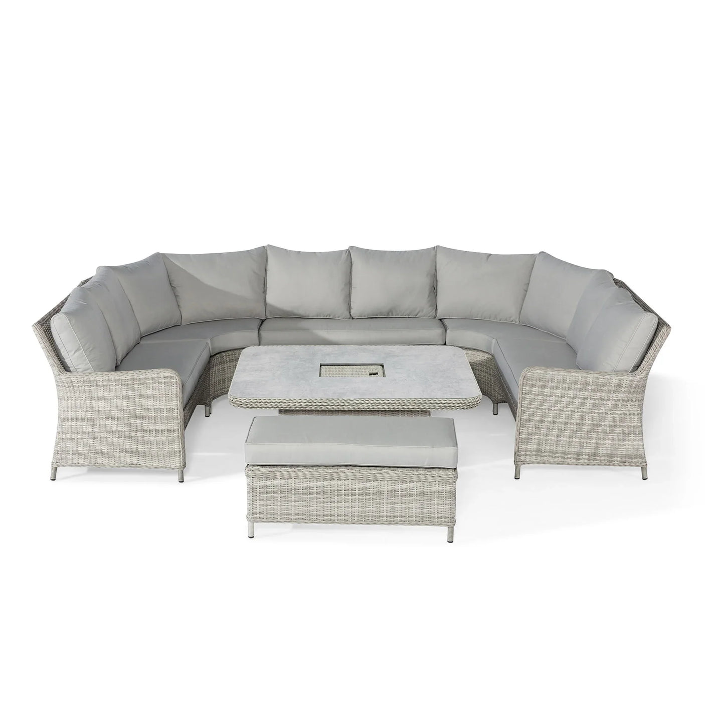 Grey rattan corner garden sofa set with cushions, square table and bench on white background