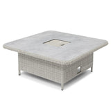 Square rattan outdoor dining table with grey stone-effect top and central cutout