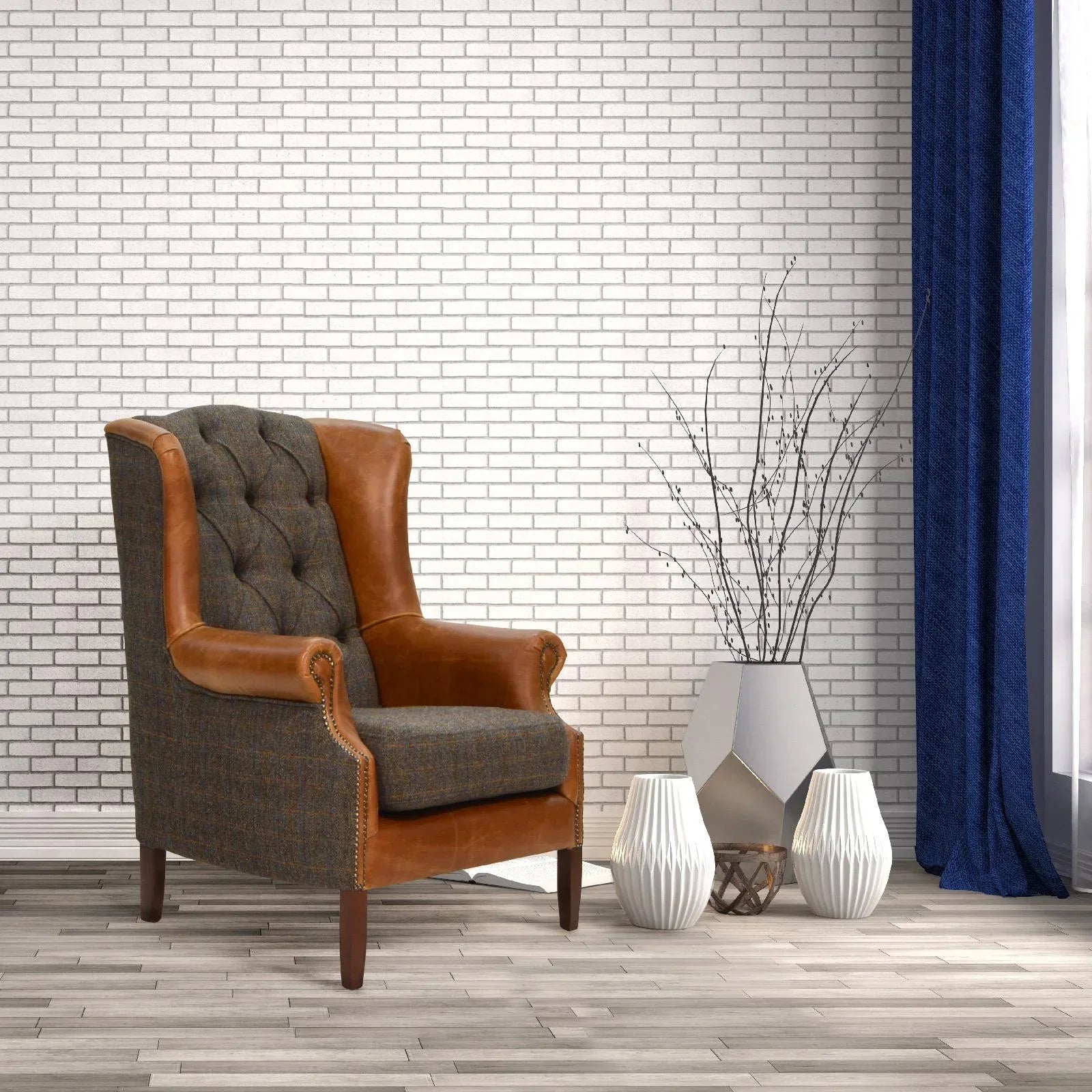 Brown leather and fabric armchair with tufted backrest beside white vases in living room