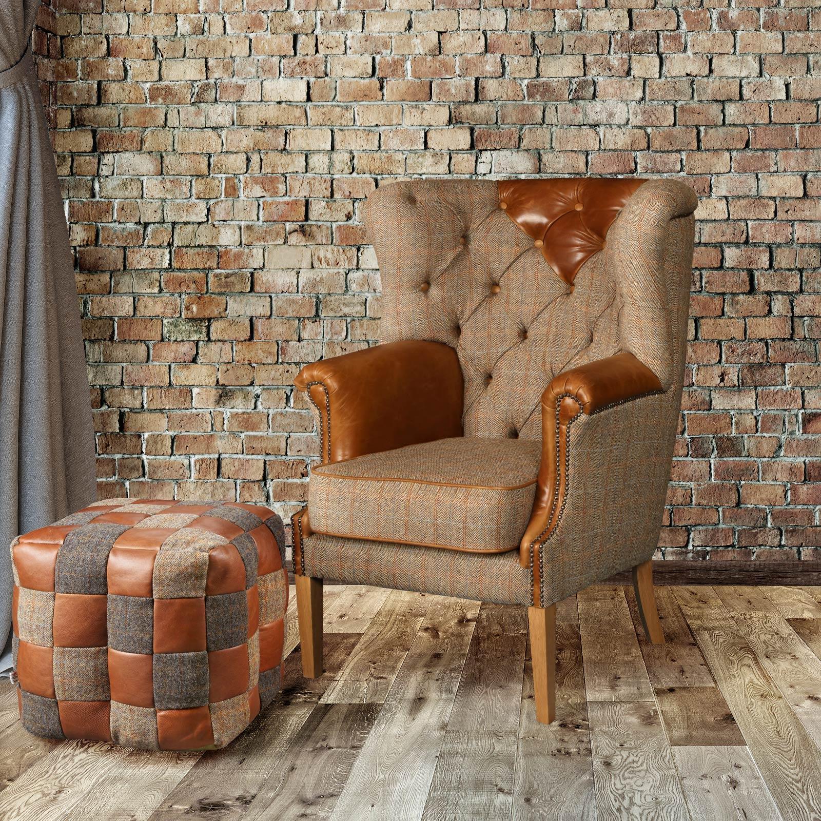 Plaid fabric and leather armchair with matching patchwork leather footstool on wood floor