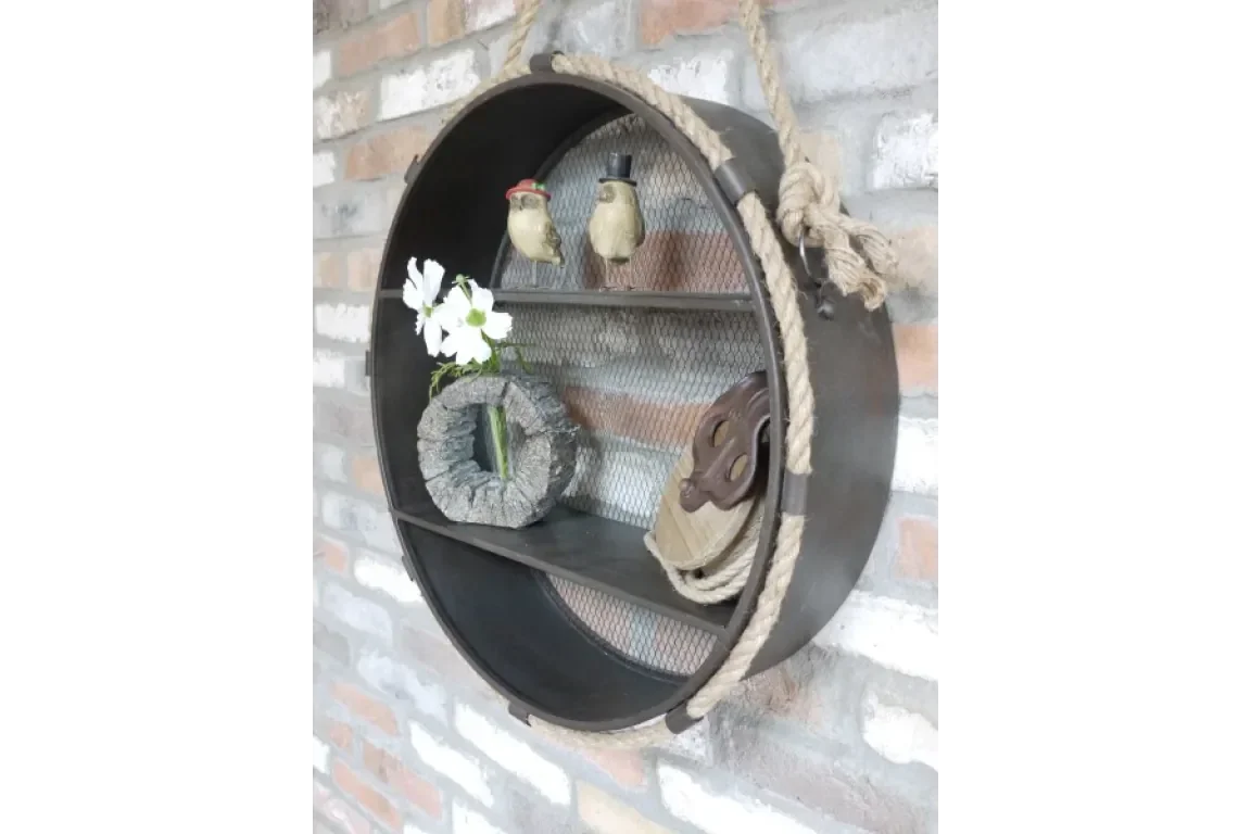 Round industrial wall shelf with rope, mesh backing, decorative figurines and flowers