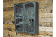 Metal wall cabinet with glass double doors, rivet details, mounted on rustic wooden plank wall, angled view.