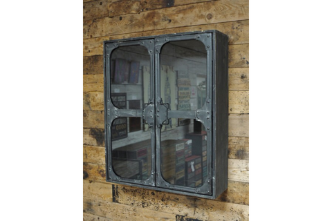 Wall-mounted black metal wall cabinet with two glass doors, viewed from a slight side angle against a wooden plank wall.