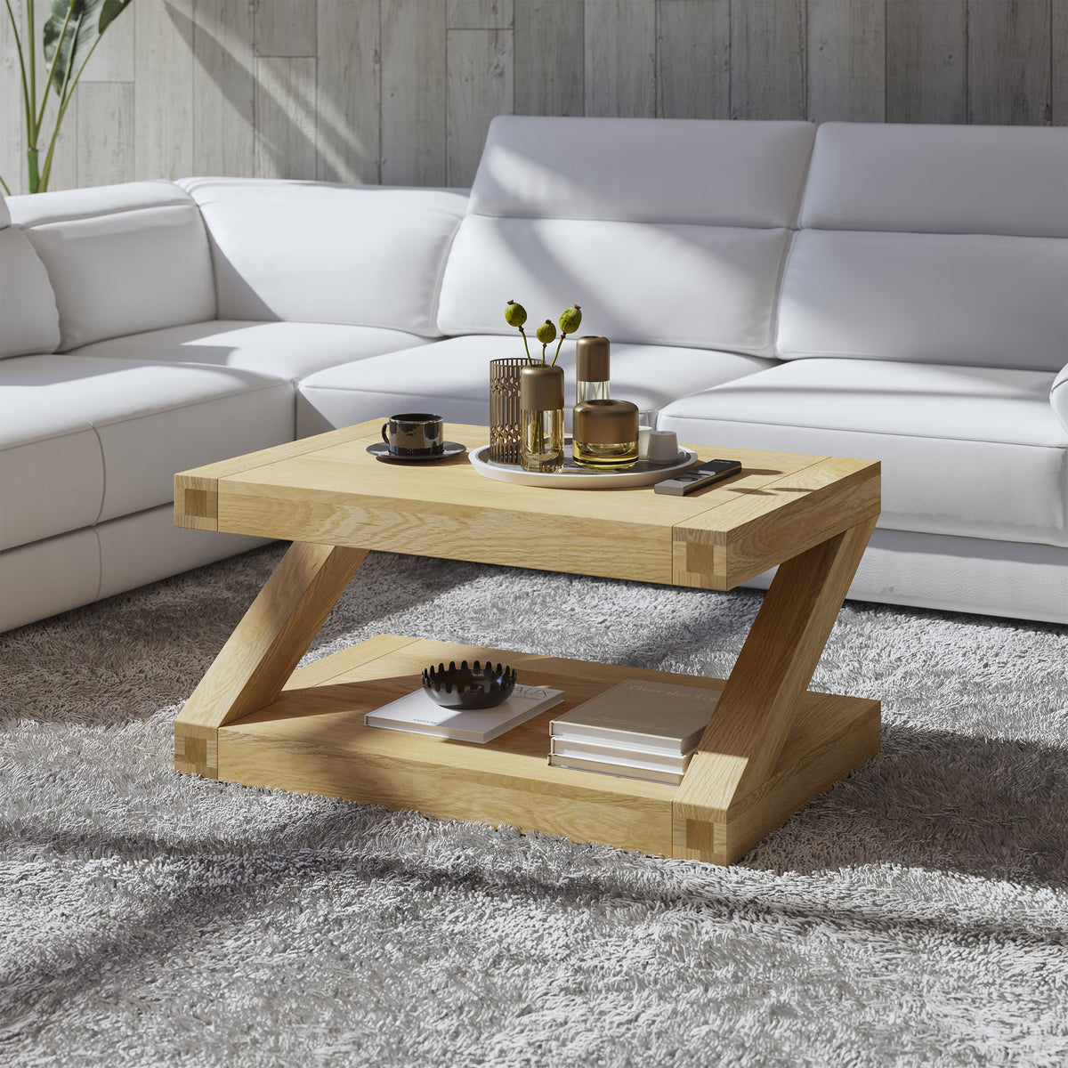 Modern oak coffee table with lower shelf on grey rug in front of white sectional sofa