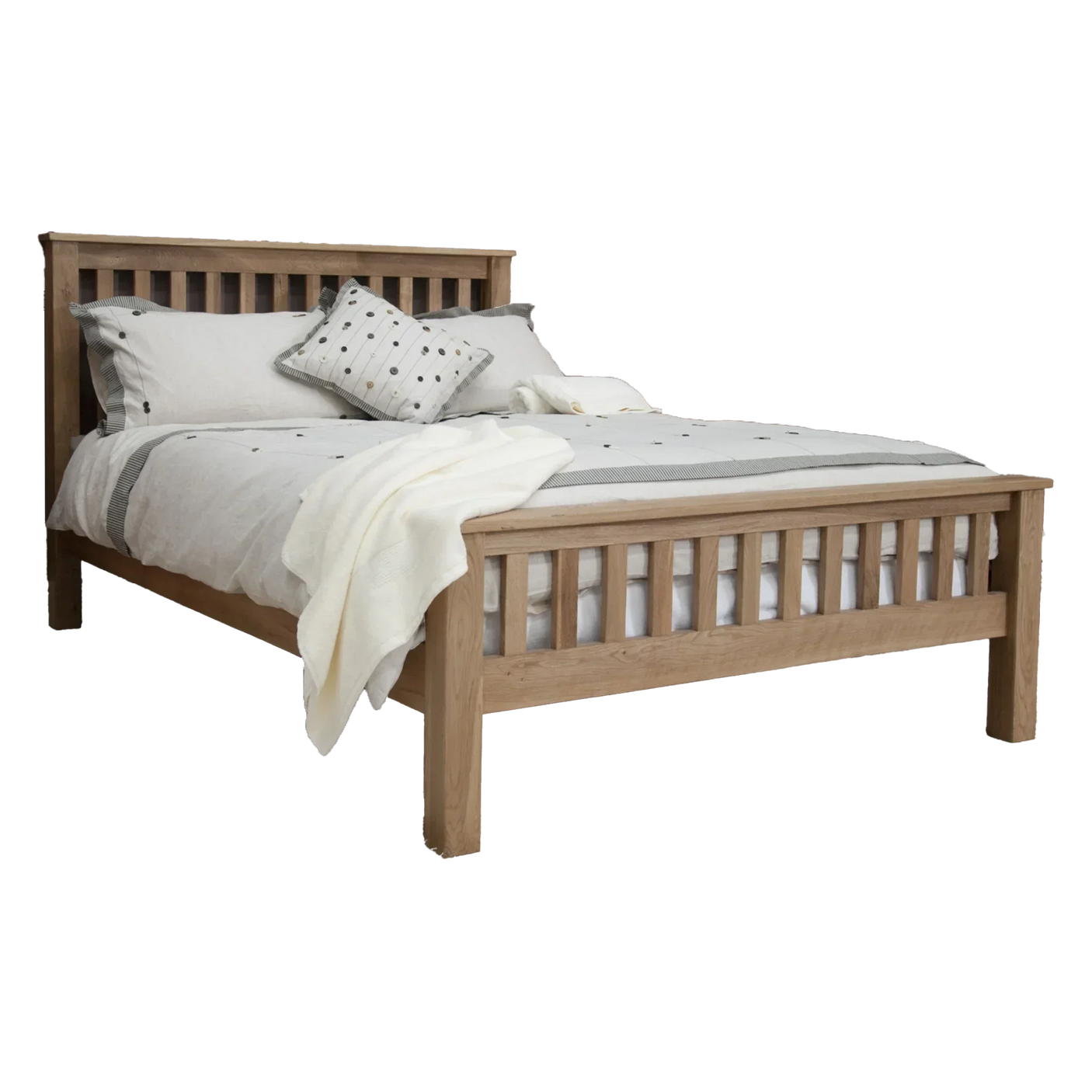 Oak wooden bed frame with slatted headboard and footboard, dressed with neutral bedding