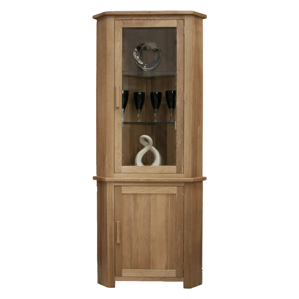 Oak corner display cabinet with glass door, wooden shelves, and decorative items inside