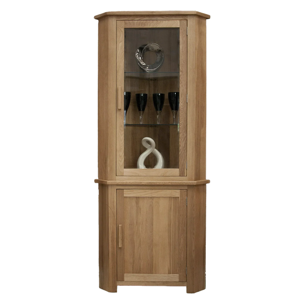 Oak corner display cabinet with glass door, wooden shelves, and decorative items inside