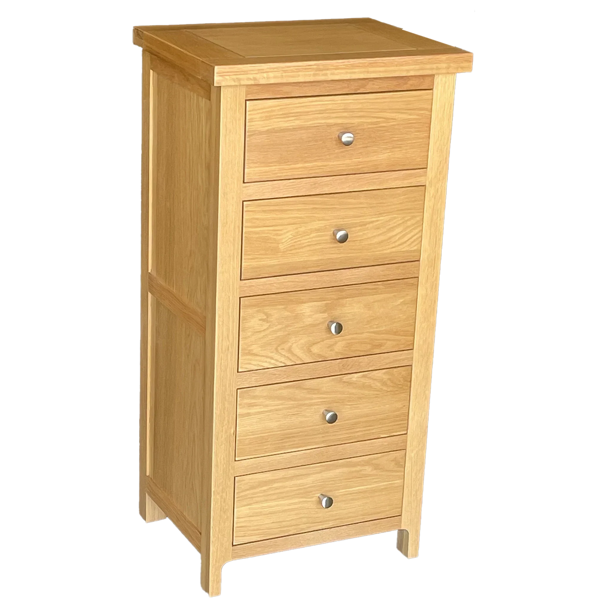 Tall oak chest of drawers with five silver handles, angled side view