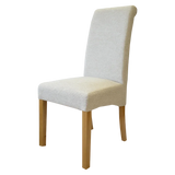 Light grey fabric dining chair with wooden legs, angled side view