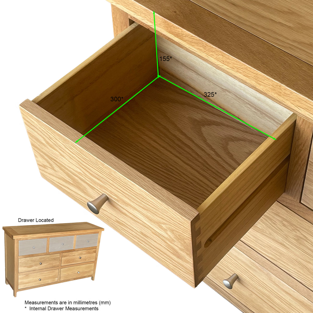 Oak chest of drawers with open drawer showing internal dimensions and metal handles