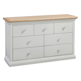 White wooden chest of drawers with oak top and silver square handles, front angle view