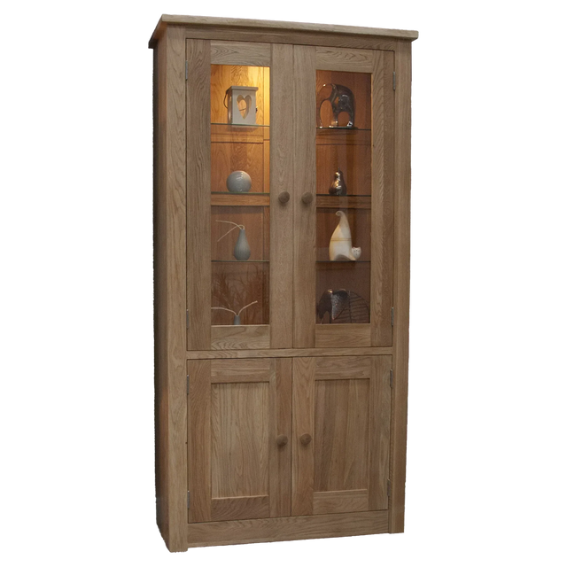 Oak display cabinet with glass doors, wooden shelves, lower storage, and decorative items