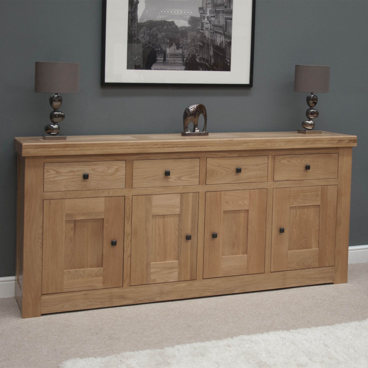 oak sideboard with four drawers and four doors in modern living room setting
