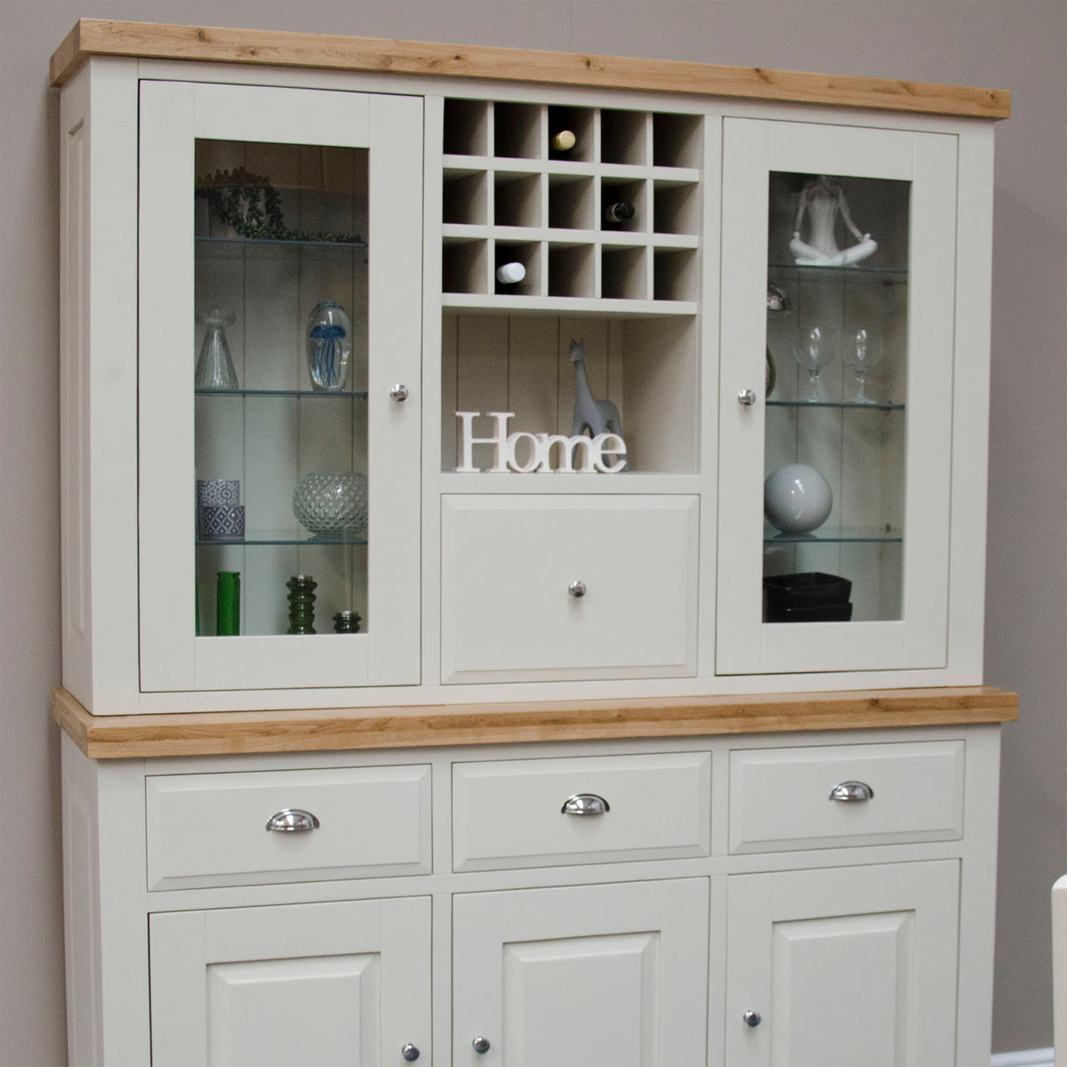 Cream kitchen dresser with glass display cabinets, oak top, and wine rack