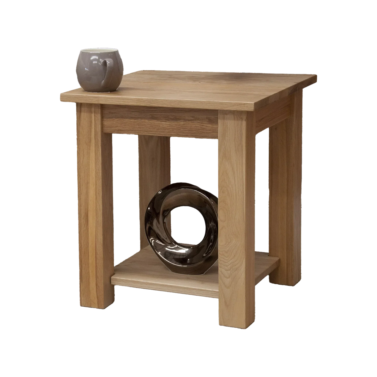 Oak side table with lower shelf, grey mug and decorative loop accent