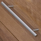 Metal drawer handle on oak wood cabinet close up