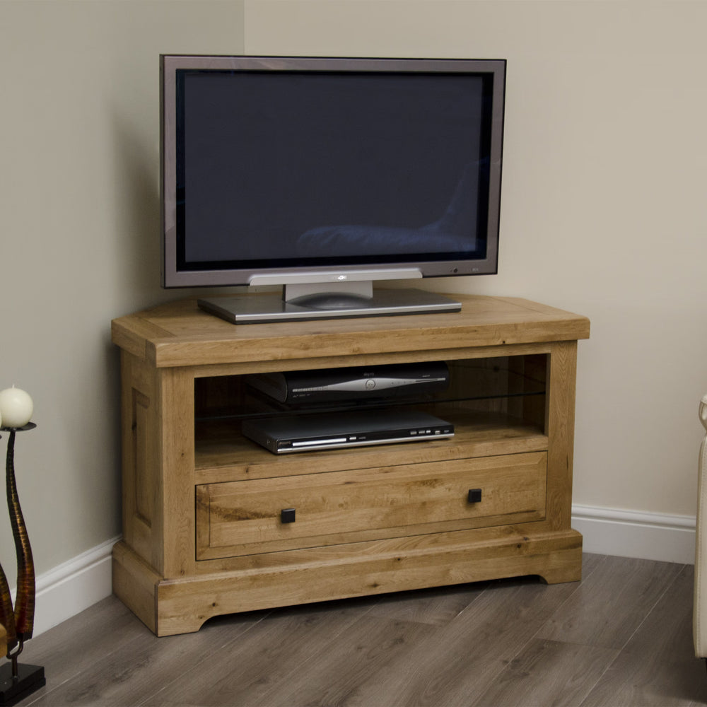 Oak TV unit with open shelf, glass panel and storage drawer on wood flooring