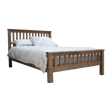 Oak wooden bed frame with slatted headboard and white bedding, side angle view