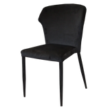 Black velvet dining chair with metal legs and curved backrest, side view