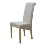 Beige upholstered dining chair with high back and light wood legs side view