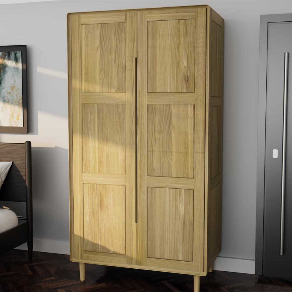 Oak wooden wardrobe with panel doors and vertical handles in bedroom corner