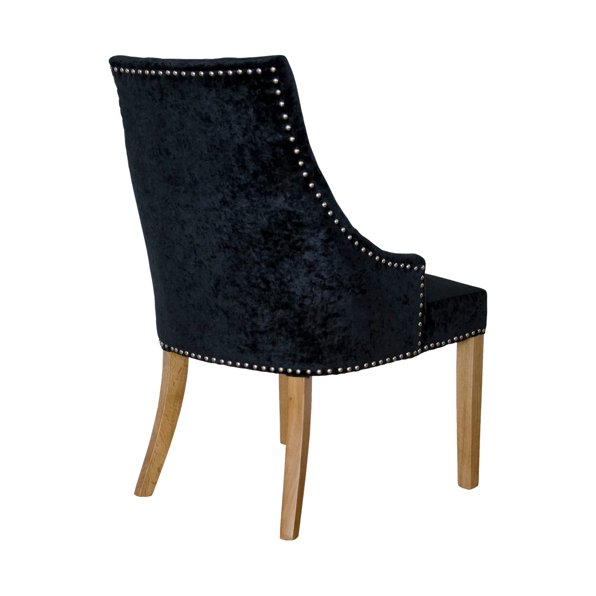 Black velvet dining chair with studded trim and light wood legs, rear angle view