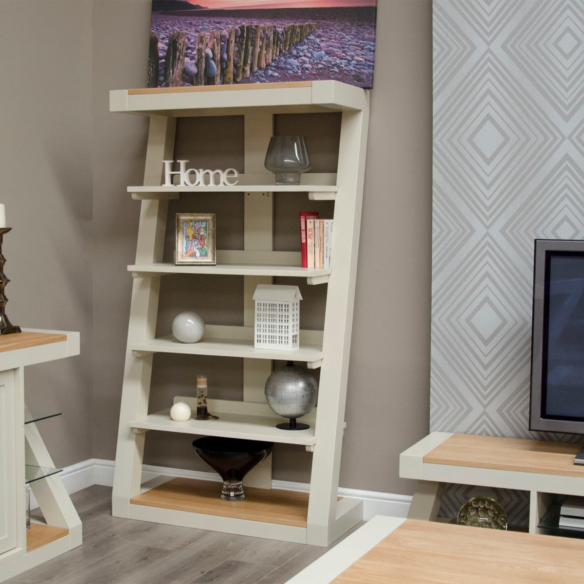Modern cream and oak bookcase with shelving, home decor, books, and accessories
