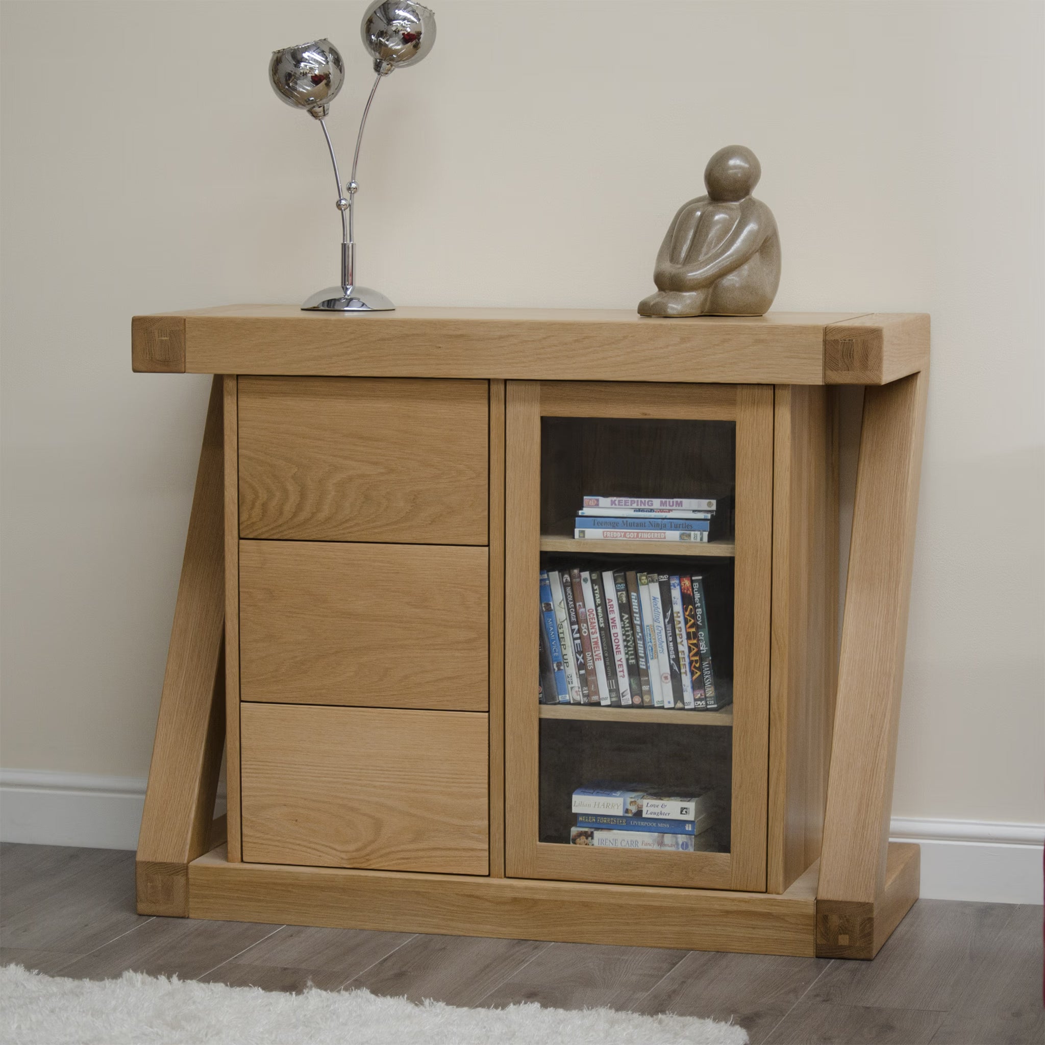 Oak sideboard with three drawers and a glass door, modern decor on top