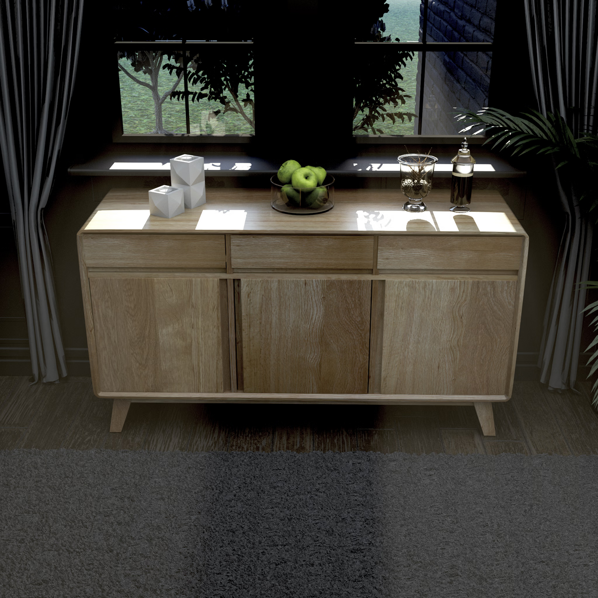 Light oak sideboard with three doors and drawers, styled with decor and a bowl of green apples