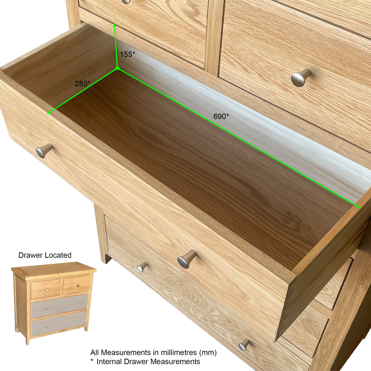 Oak chest of drawers with open drawer showing internal measurements in millimetres