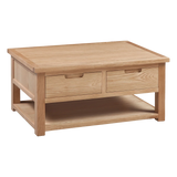 Oak coffee table with two drawers and lower shelf, natural wood finish, angled view
