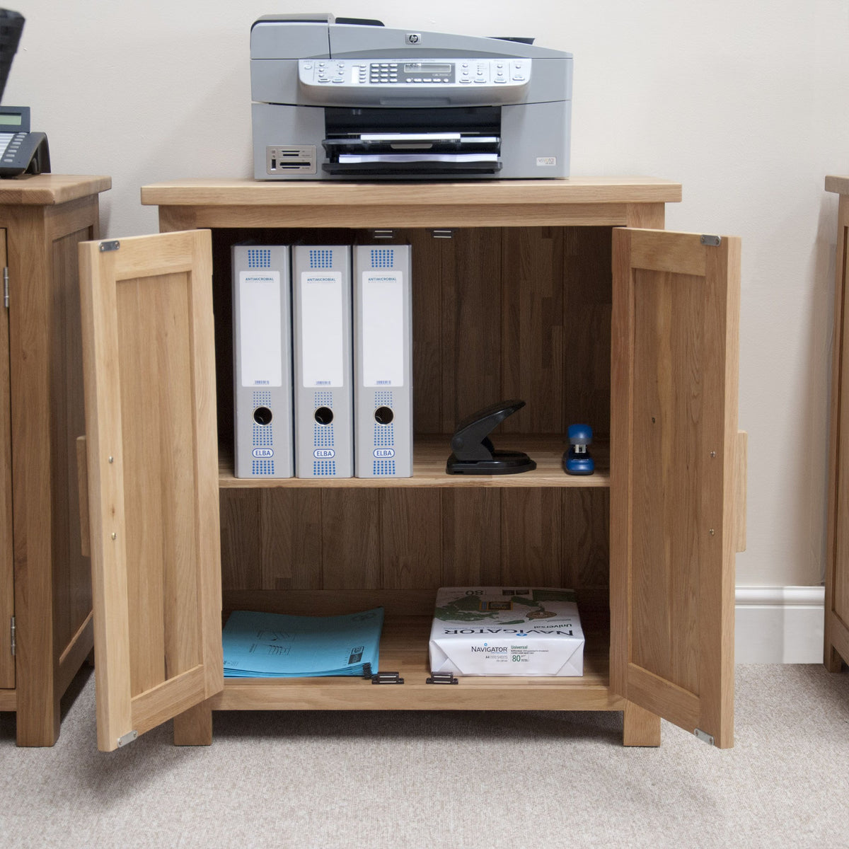 Oak filing cabinet with printer on top, shelves storing office folders and stationery